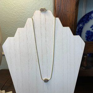 Kendra Scott silver druzy necklace set in gold and ring.